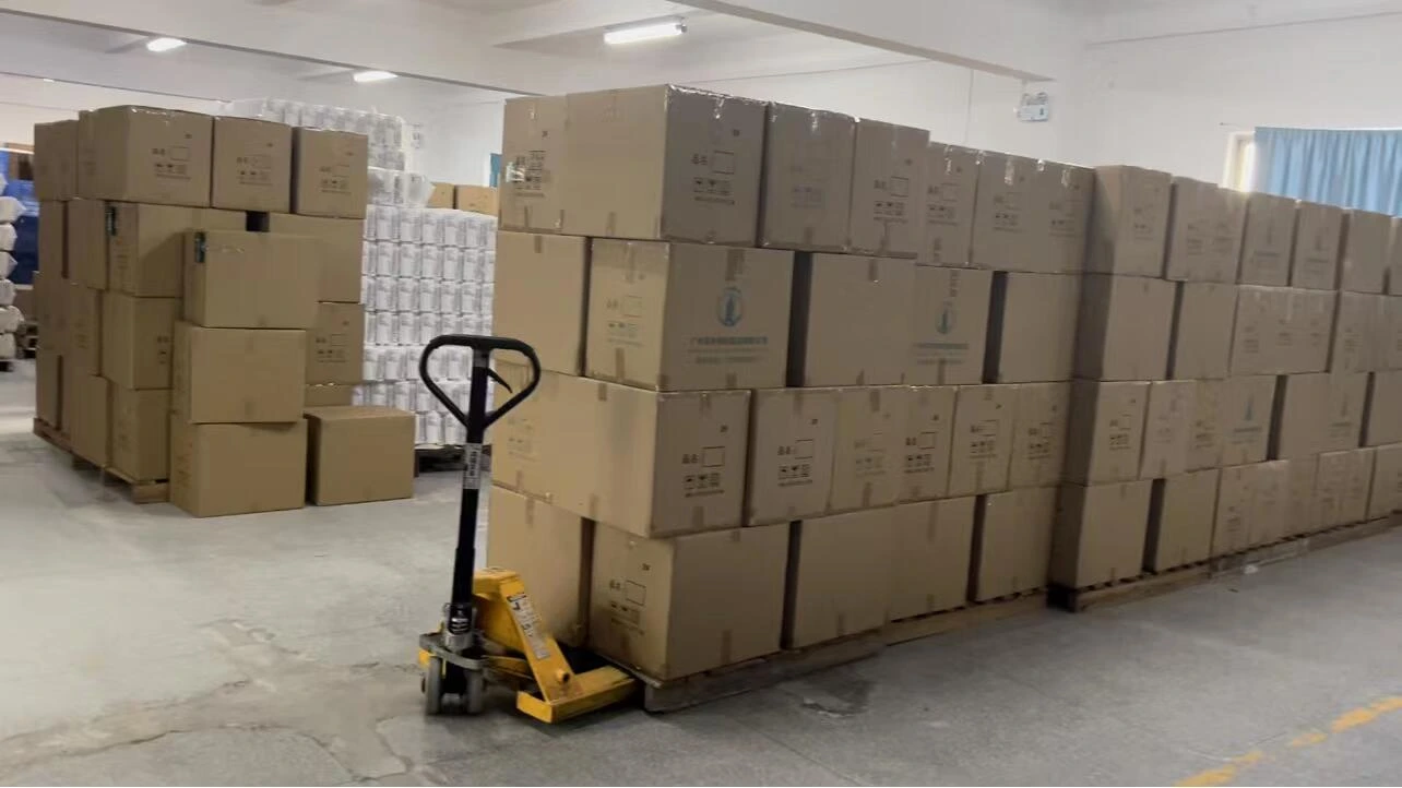 Cartons stacked on pallets with a pallet truck